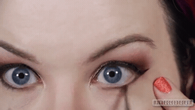Woman Applying Makeup To Eye GIF