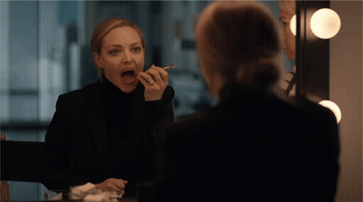 Woman Applying Makeup With Mouth Open GIF