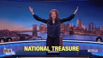 Woman Arms Outstretched In Front Of National Treasure Screen GIF