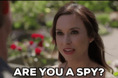 Woman Asking Man If He Is A Spy GIF
