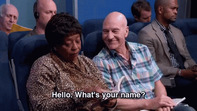 Woman Asking Man What's His Name On Plane GIF