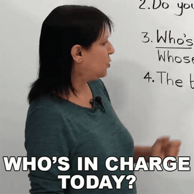 Woman Asking Who's In Charge Today At Whiteboard GIF