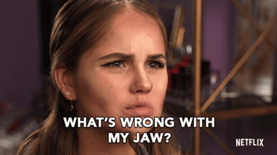 Woman Asks What's Wrong With My Jaw At Netflix Sign GIF