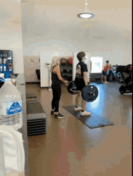 Woman Assisting Man With Deadlift GIF