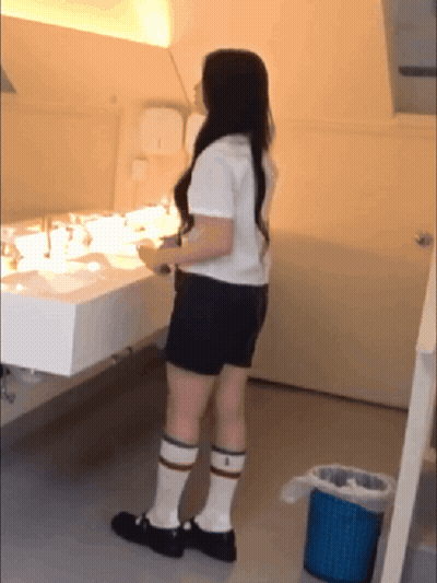 Woman At Bathroom Sink GIF