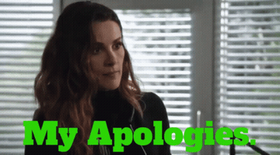 Woman At Blinds Saying My Apologies In Green GIF