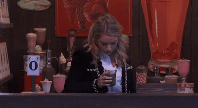 Woman At Counter With O Sign GIF