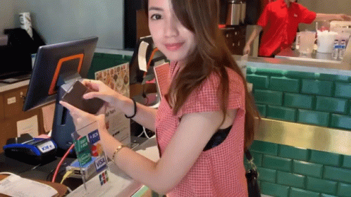 Woman At Counter With Visa Card GIF