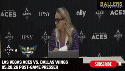 Woman At Desk In Front Of Las Vegas Aces Vs Dallas Wings Wall GIF