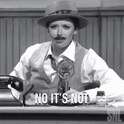 Woman At Desk Saying No It's Not GIF