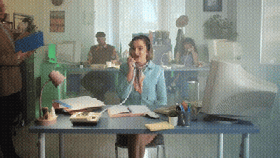 Woman At Desk Talking On Phone With Sign Words Think Speak GIF