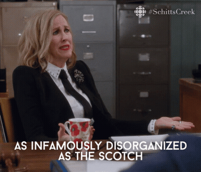 Woman At Desk With Coffee As Infamously Disorganized As The Scotch GIF