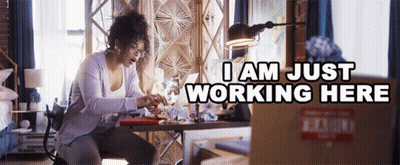 Woman At Desk With Laptop Saying I Am Just Working Here GIF