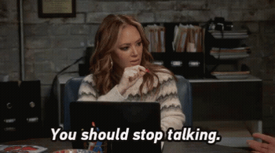 Woman at Desk With Laptop Says You Should Stop Talking