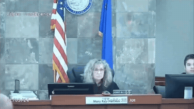 Woman At Desk With Mary Sign GIF