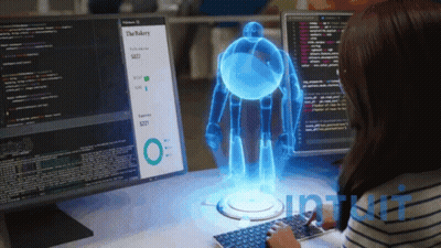 Woman At Desk With Monitor Saying The Bakery GIF