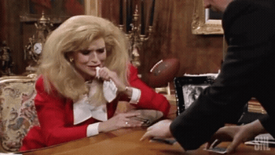 Woman At Desk With SNL Logo GIF