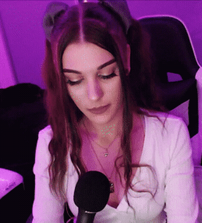 Woman At Microphone In Purple Lights GIF