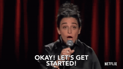 Woman At Microphone Saying Okay Let's Get Started GIF