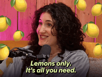 Woman At Microphone Says Lemons Is All You Need Surrounded By Lemons GIF