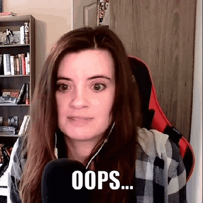 Woman At Microphone With Bookshelf Saying Oops GIF
