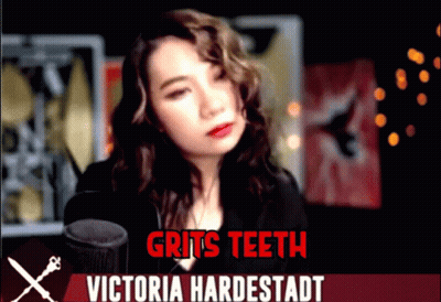 Woman At Microphone With Gritted Teeth Victoria Hardestadt GIF