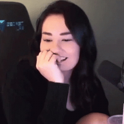 Woman At Microphone With Hand On Mouth GIF