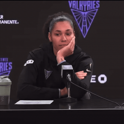 Woman At Microphone With Valkyries Logo GIF