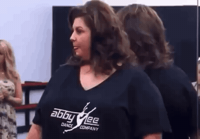 Woman At Mirror In Black Shirt GIF