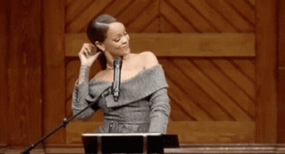 Woman At Podium With Microphone GIF