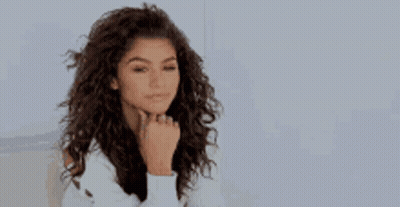 Woman At Table And Man On Couch GIF