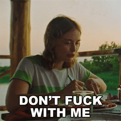 Woman At Table Saying Don't Fuck With Me GIF