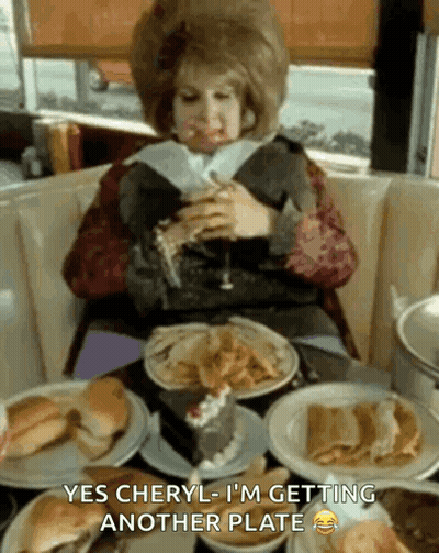 Woman At Table Saying Getting Another Plate GIF