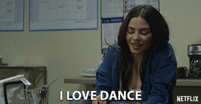 Woman At Table Saying I Love Dance GIF