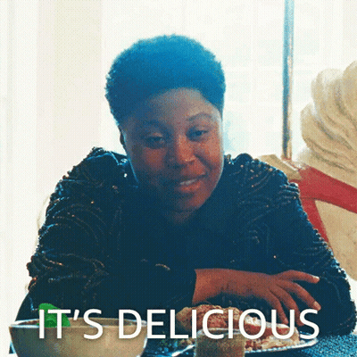 Woman At Table Saying It's Delicious GIF