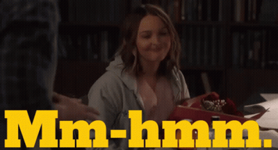 Woman At Table Saying Mm-Hmm GIF