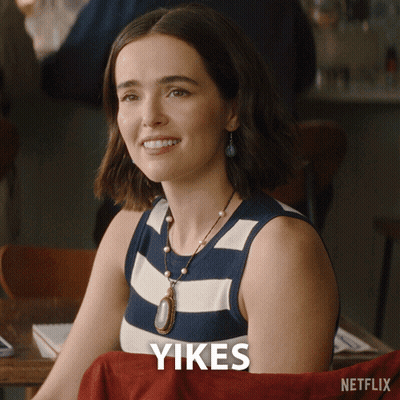 Woman At Table Saying Yikes GIF