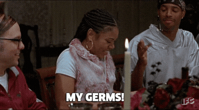 Woman At Table With Candle Says My Germs GIF