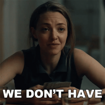 Woman At Table With Card Saying We Don't Have GIF