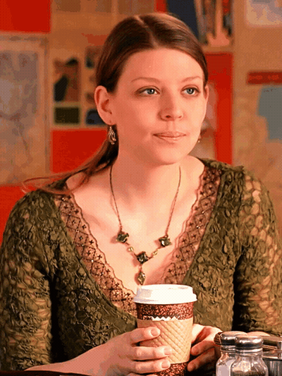 Woman At Table With Cup Of Coffee GIF