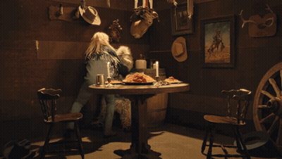 Woman At Table With Food And Candles GIF