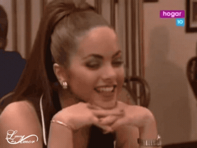 Woman At Table With Hogar Sign GIF