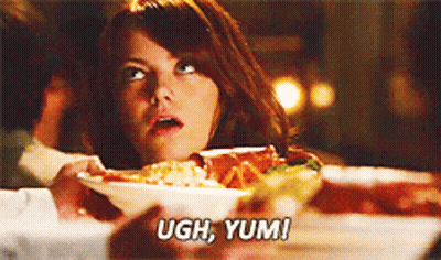 Woman At Table With Plate Of Food Saying Ugh Yum GIF
