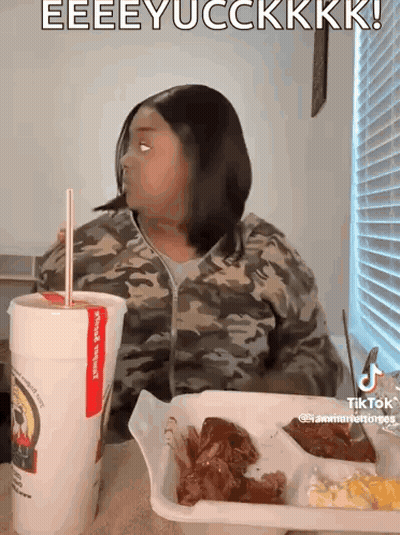 Woman At Table With Tray Of Food And Drink GIF