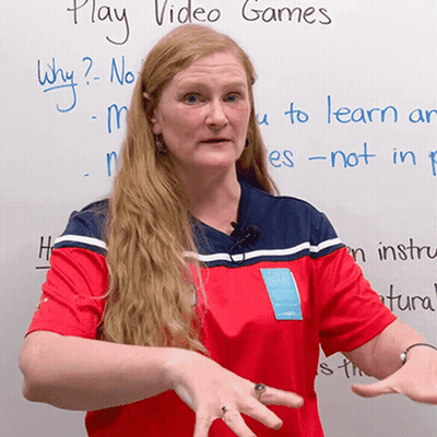 Woman At White Board Saying Play Video Games GIF