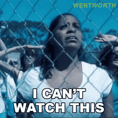 Woman Behind Chain Link Fence Saying I Can't Watch This GIF