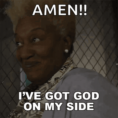 Woman Behind Chain Link Fence Smiling Says Amen I've Got God On My Side GIF
