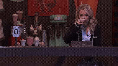 Woman Behind Counter With O Sign GIF