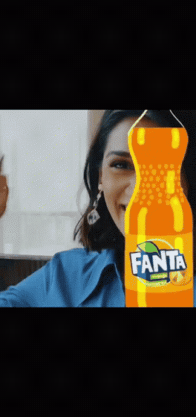 Woman Behind Fanta Orange Soda GIF
