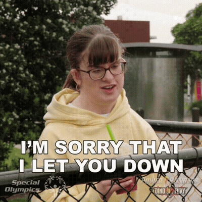 Woman Behind Fence Saying I'm Sorry GIF